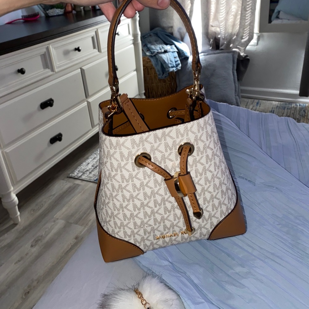 Crossbody bag and mini handbag all in one